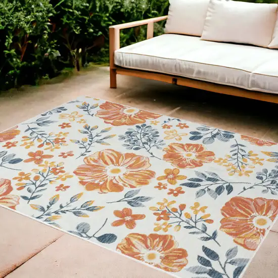 Ivory Orange and Blue Floral Stain Resistant Indoor Outdoor Area Rug Photo 1