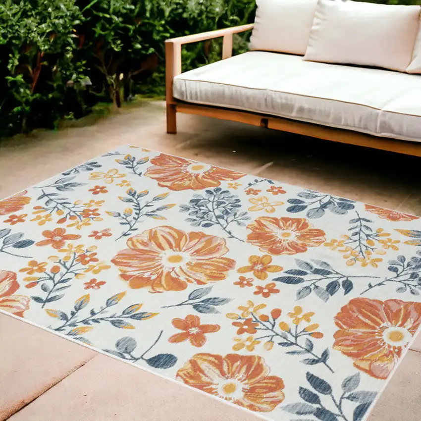 Ivory Orange and Blue Floral Stain Resistant Indoor Outdoor Area Rug Photo 1
