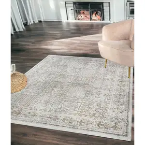 Photo of Ivory Oriental Distressed Area Rug With Fringe