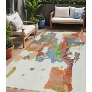 Photo of Ivory Pink And Green Abstract Washable Indoor Outdoor Area Rug
