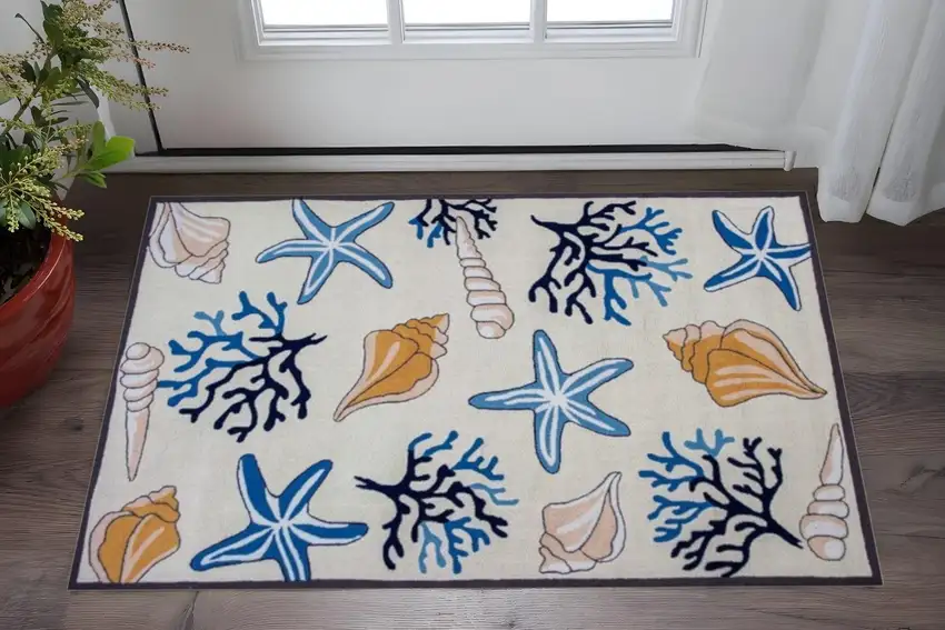 Ivory Blue And Brown Seashell and Coral Hand Tufted Area Rug Photo 1