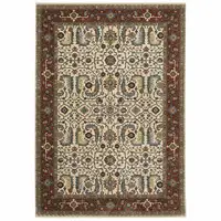 Photo of Ivory Red Green Grey Blue And Navy Oriental Power Loom Stain Resistant Area Rug With Fringe