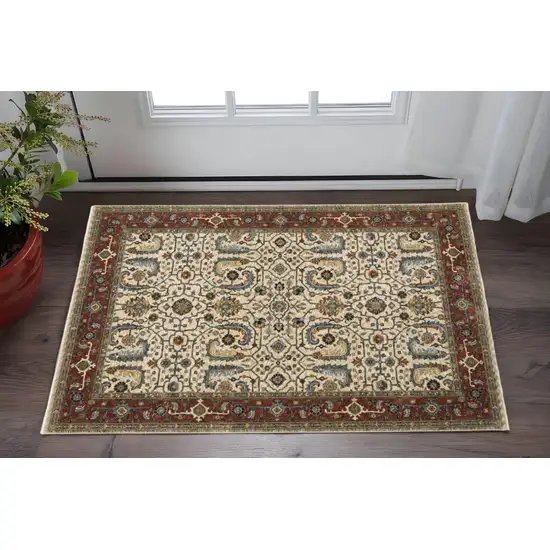 Ivory Red Green Grey Blue And Navy Oriental Power Loom Stain Resistant Area Rug With Fringe Photo 1