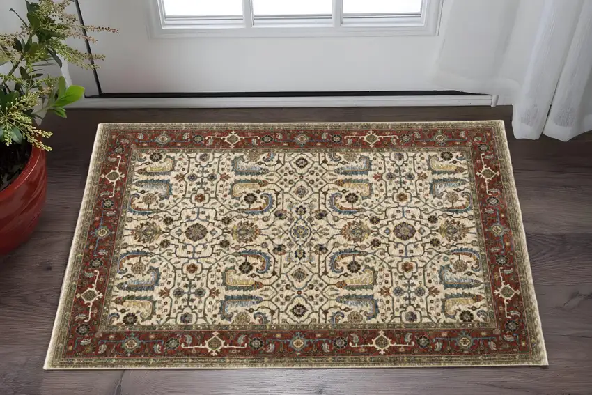 Ivory Red Green Grey Blue And Navy Oriental Power Loom Stain Resistant Area Rug With Fringe Photo 1