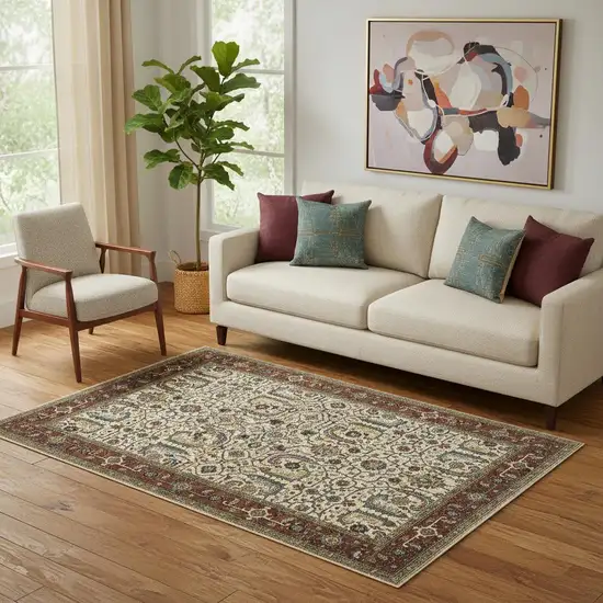 Ivory Red Green Grey Blue And Navy Oriental Power Loom Stain Resistant Area Rug With Fringe Photo 1