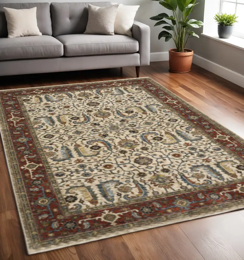 Ivory Red Green Grey Blue And Navy Oriental Power Loom Stain Resistant Area Rug With Fringe Photo 1