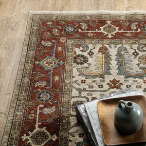Photo of Ivory Red Green Grey Blue And Navy Oriental Power Loom Stain Resistant Area Rug With Fringe