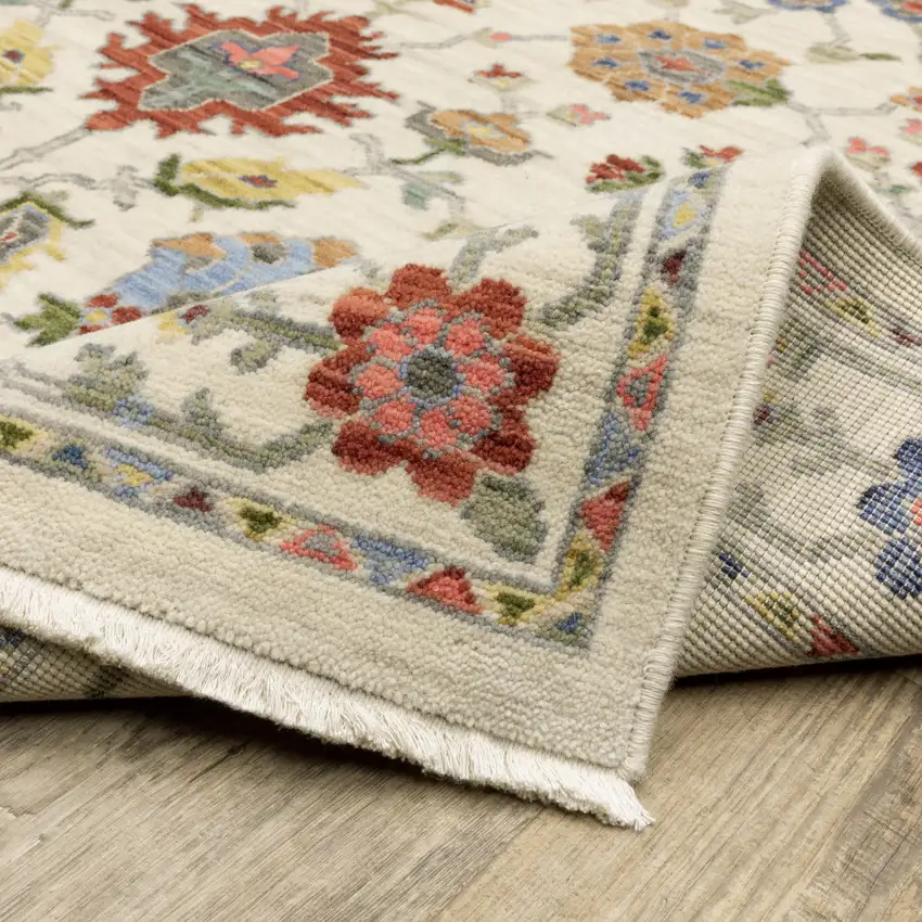 6' X 9' Ivory Salmon Pink Gold Blues Grey Rust And Green Oriental Power Loom Stain Resistant Area Rug With Fringe Photo 8