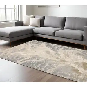 Photo of Ivory Silver And Gold Abstract Stain Resistant Area Rug