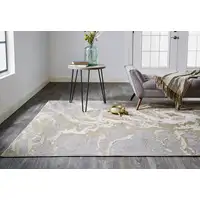 Photo of Ivory Silver And Gold Abstract Stain Resistant Area Rug