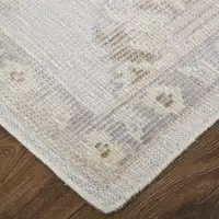 Photo of Ivory Silver And Tan Floral Hand Knotted Stain Resistant Area Rug