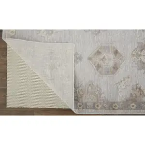 Photo of Ivory Silver And Tan Floral Hand Knotted Stain Resistant Area Rug