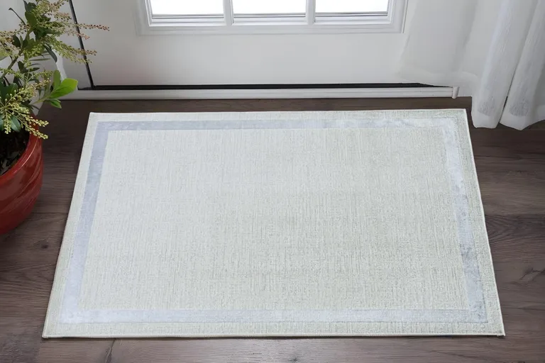Ivory Silver Machine Woven Bordered Indoor Area Rug Photo 3