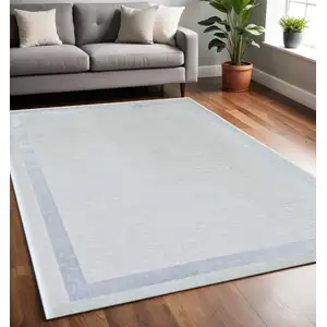 Photo of Ivory Silver Machine Woven Bordered Indoor Area Rug