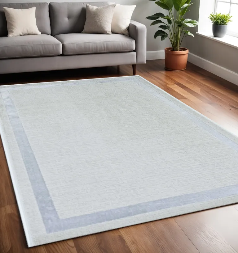 Ivory Silver Machine Woven Bordered Indoor Area Rug Photo 1