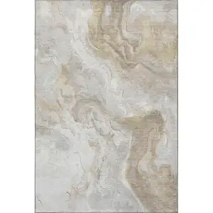 Photo of Ivory Tan And Beige Abstract Washable Area Rug With UV Protection