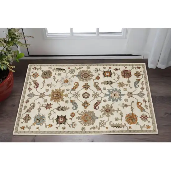 Ivory Tan And Black Oriental Area Rug Photo 1