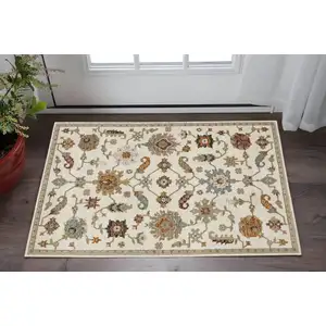 Photo of Ivory Tan And Black Oriental Area Rug