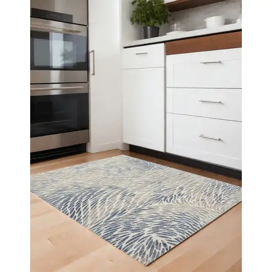 Ivory Tan And Blue Abstract Area Rug Photo 1