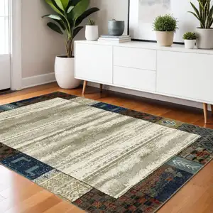 Photo of Ivory Tan And Blue Patchwork Area Rug