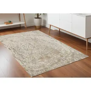 Photo of Ivory Tan And Gray Abstract Area Rug