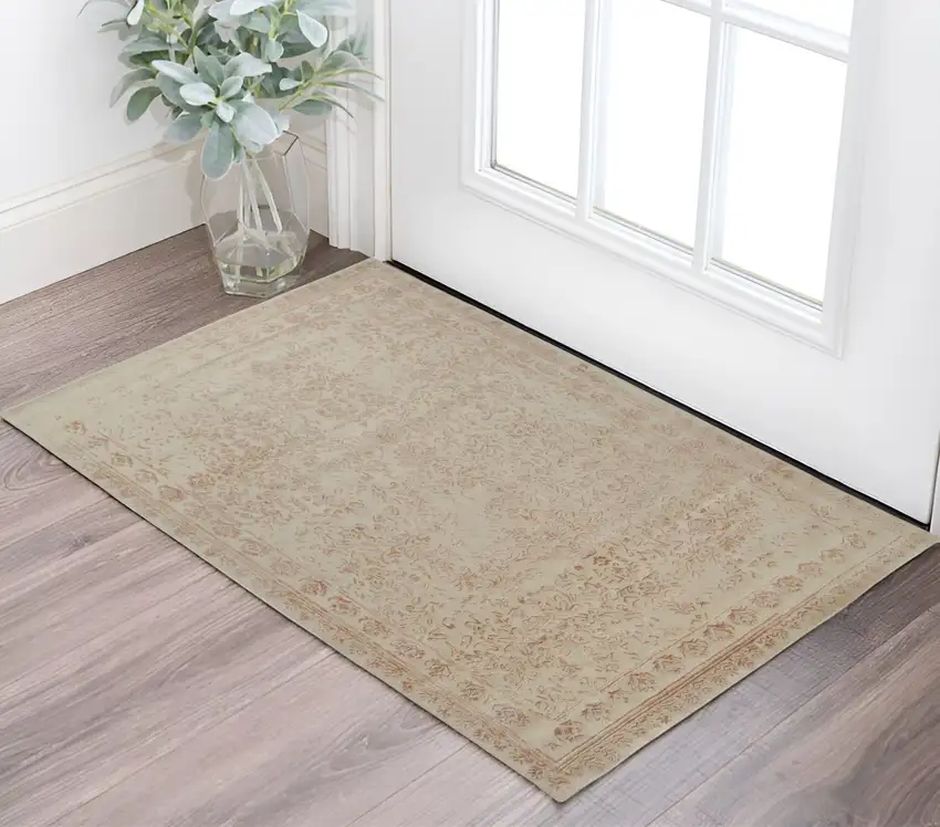 Pink and Ivory Wool Floral Hand Tufted Distressed Area Rug Photo 1