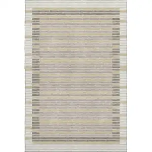 Photo of Ivory Tan And Taupe Striped Washable Area Rug With UV Protection