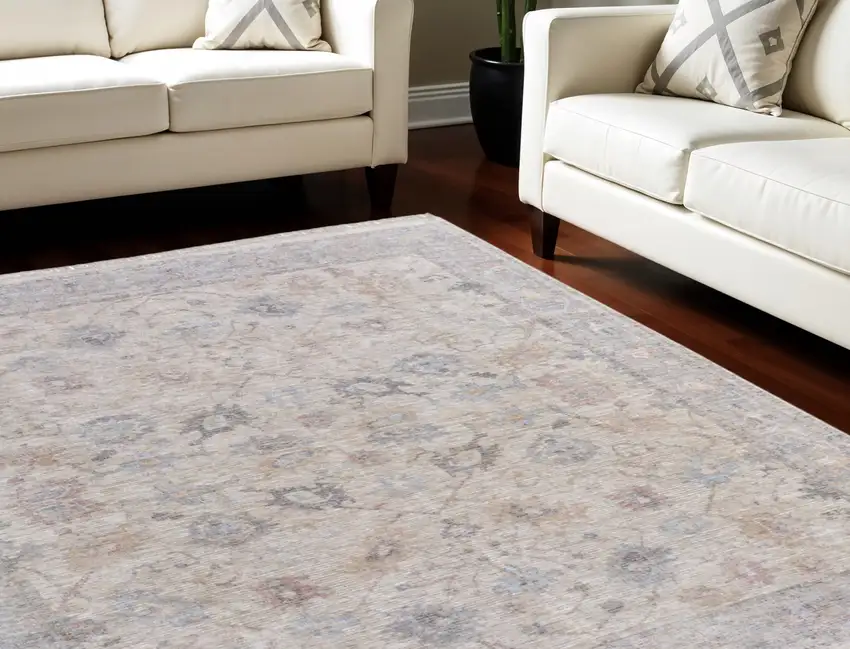 Ivory Tan and Blue Floral Hand Woven Distressed Area Rug With Fringe Photo 1