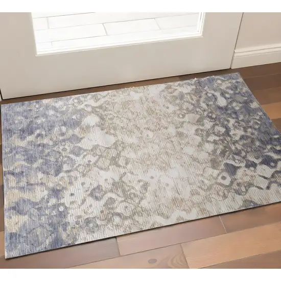 Ivory Tan And Blue Abstract Area Rug Photo 1