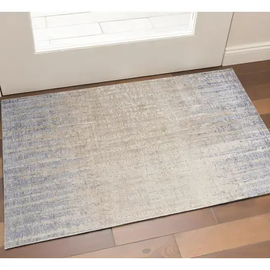 Tan And Blue Abstract Distressed Area Rug Photo 1