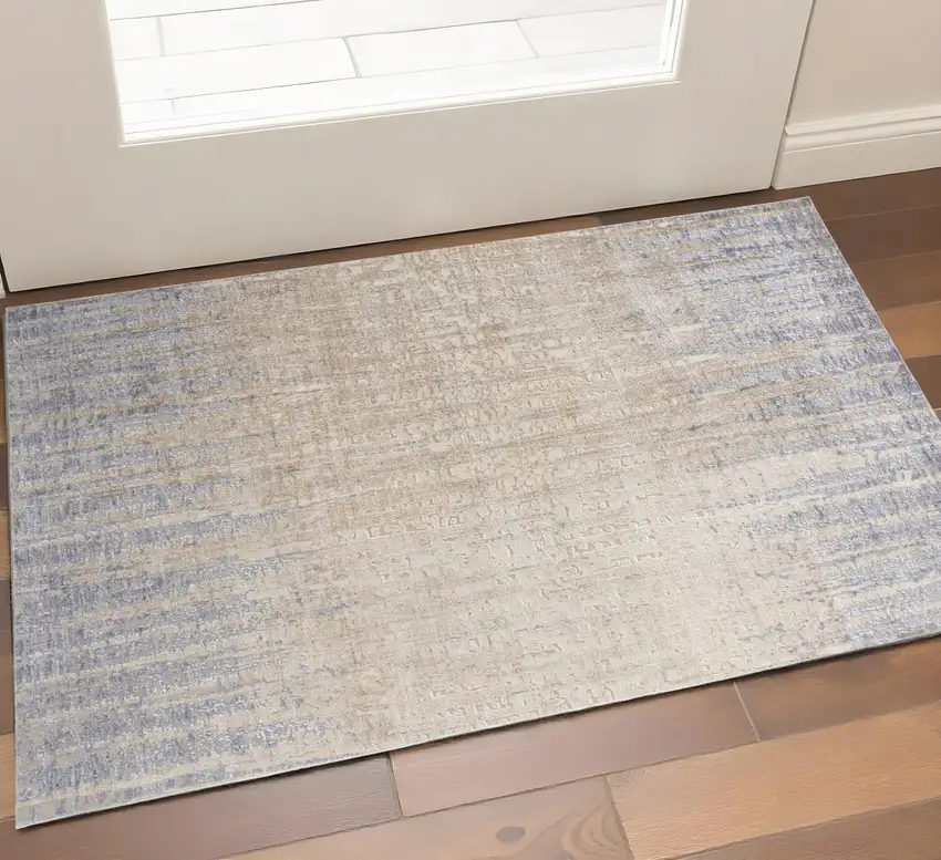 Tan And Blue Abstract Distressed Area Rug Photo 1