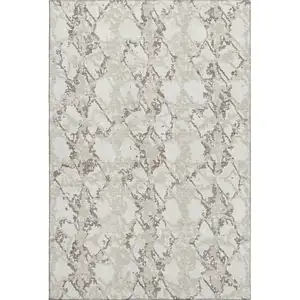 Photo of Ivory Taupe And Beige Abstract Washable Area Rug With UV Protection