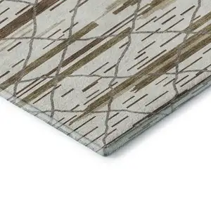 Photo of Ivory Taupe And Beige Striped Washable Area Rug With UV Protection