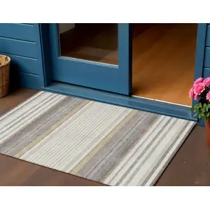 Photo of Ivory Taupe And Beige Striped Washable Indoor Outdoor Area Rug