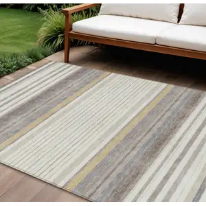 Photo of Ivory Taupe And Beige Striped Washable Indoor Outdoor Area Rug
