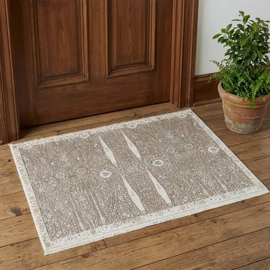 Ivory Taupe And Gold Floral Area Rug With Fringe Photo 1
