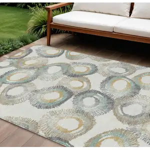 Photo of Ivory Taupe And Gold Geometric Washable Indoor Outdoor Area Rug