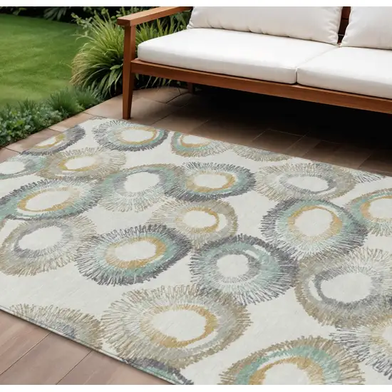 Ivory Taupe And Gold Geometric Washable Indoor Outdoor Area Rug Photo 1