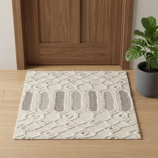 Ivory Taupe And Tan Wool Geometric Tufted Handmade Stain Resistant Area Rug Photo 1