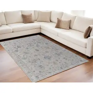 Photo of Ivory Taupe and Blue Floral Power Loom Worn Faded Area Rug With Fringe