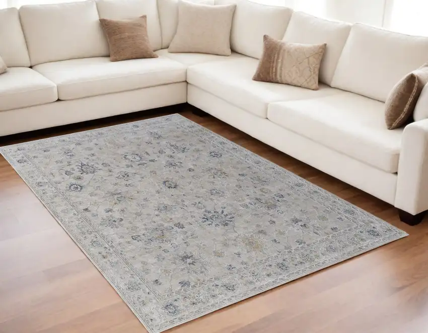 Ivory Taupe and Blue Floral Power Loom Worn Faded Area Rug With Fringe Photo 1