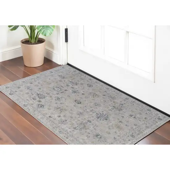 Ivory Taupe and Blue Floral Power Loom Worn Faded Area Rug With Fringe Photo 1