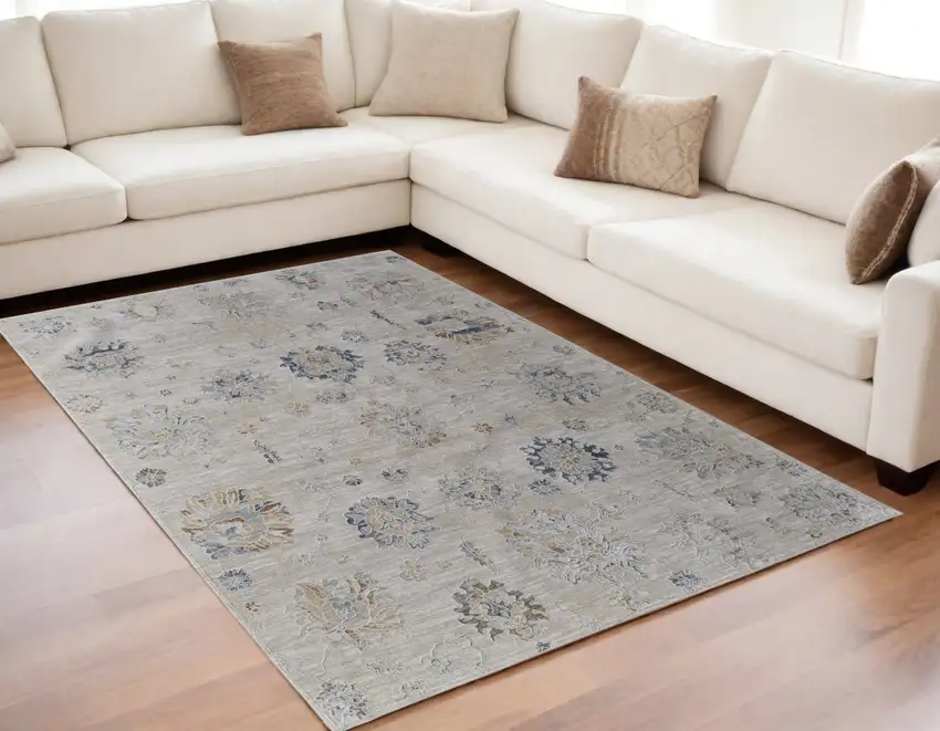 Ivory Taupe and Blue Floral Power Loom Worn Faded Area Rug With Fringe Photo 1
