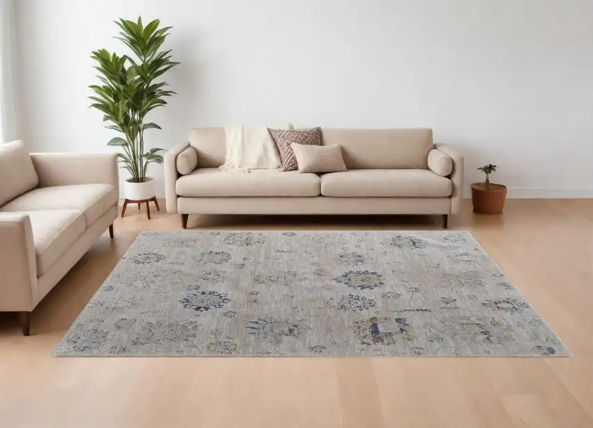Ivory Taupe and Blue Floral Power Loom Worn Faded Area Rug With Fringe Photo 1