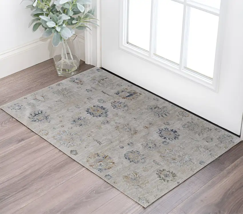 Ivory Taupe and Blue Floral Power Loom Worn Faded Area Rug With Fringe Photo 1
