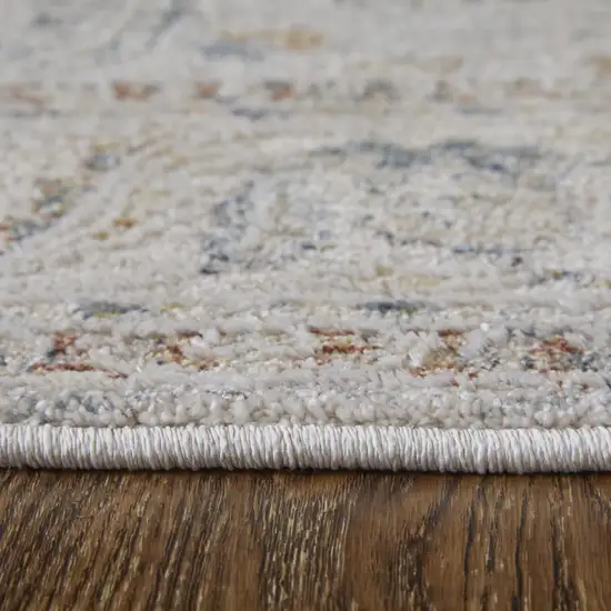 Ivory Taupe and Blue Ikat Power Loom Worn Faded Area Rug With Fringe Photo 8