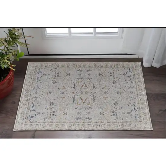 Ivory Taupe and Blue Ikat Power Loom Worn Faded Area Rug With Fringe Photo 1