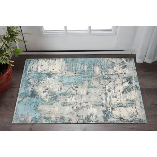 Ivory And Teal Abstract Area Rug Photo 1