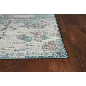 Photo of Ivory Teal Machine Woven Abstract Indoor Area Rug