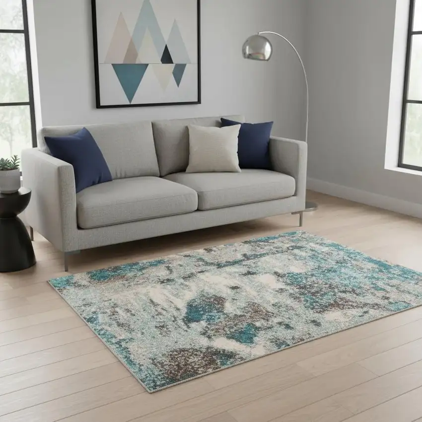 Ivory And Teal Abstract Area Rug Photo 1